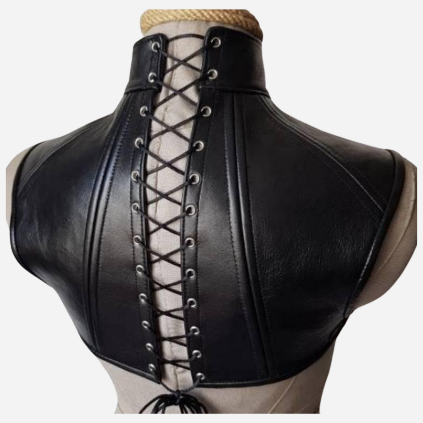 Elevate your style with our Premium Leather Neck Corset, featuring a versatile O-ring and adjustable lacing back for a secure fit. Crafted from high-quality leather, this corset blends elegance and edginess, making it the perfect accessory for any outfit. Explore custom sizing and make a bold fashion statement today!