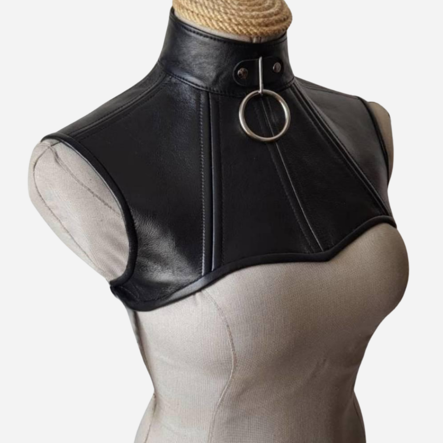 Elevate your style with our Premium Leather Neck Corset, featuring a versatile O-ring and adjustable lacing back for a secure fit. Crafted from high-quality leather, this corset blends elegance and edginess, making it the perfect accessory for any outfit. Explore custom sizing and make a bold fashion statement today!